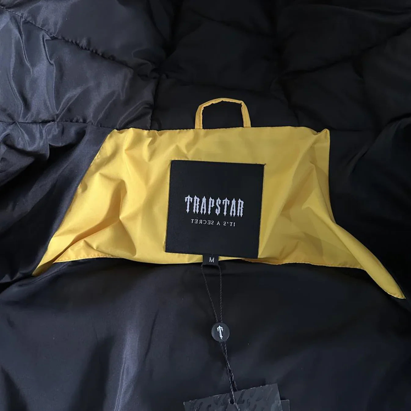 TRAPSTAR IRONGATE ARCH PUFFER AW23 (YELLOW/BLACK)